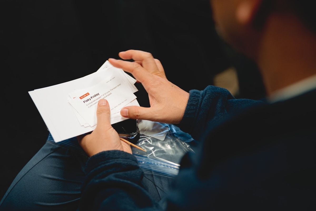 A leader holding seat cards during the breakout